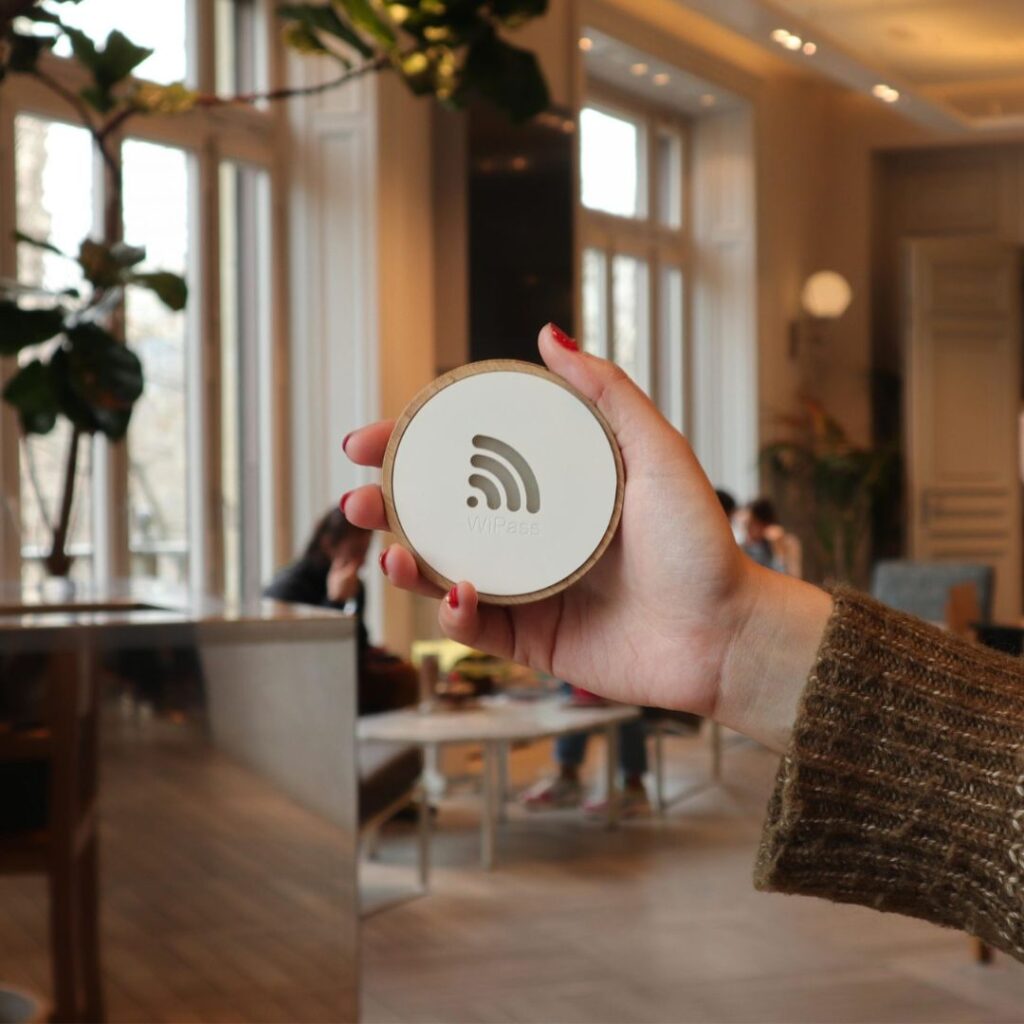 WiPass wireless access device held in a hotel lobby